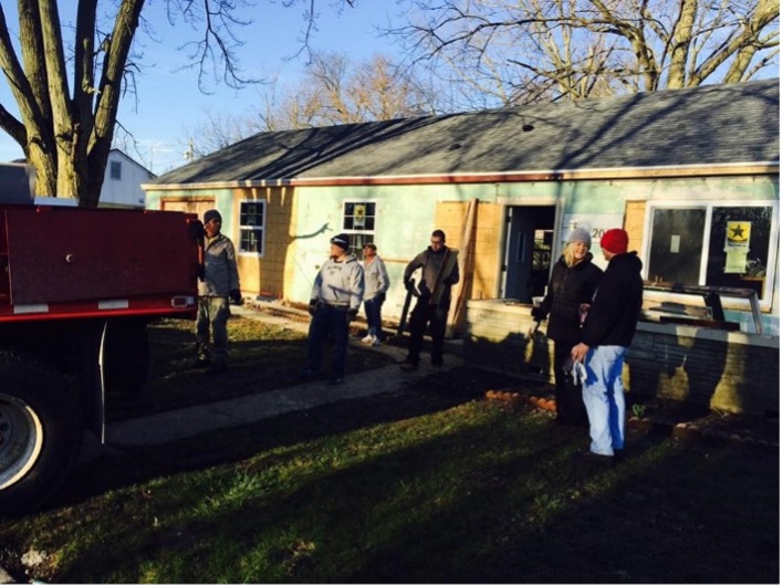 People working on building a single-story home