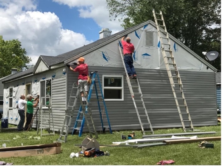 Roofers working on building a new home